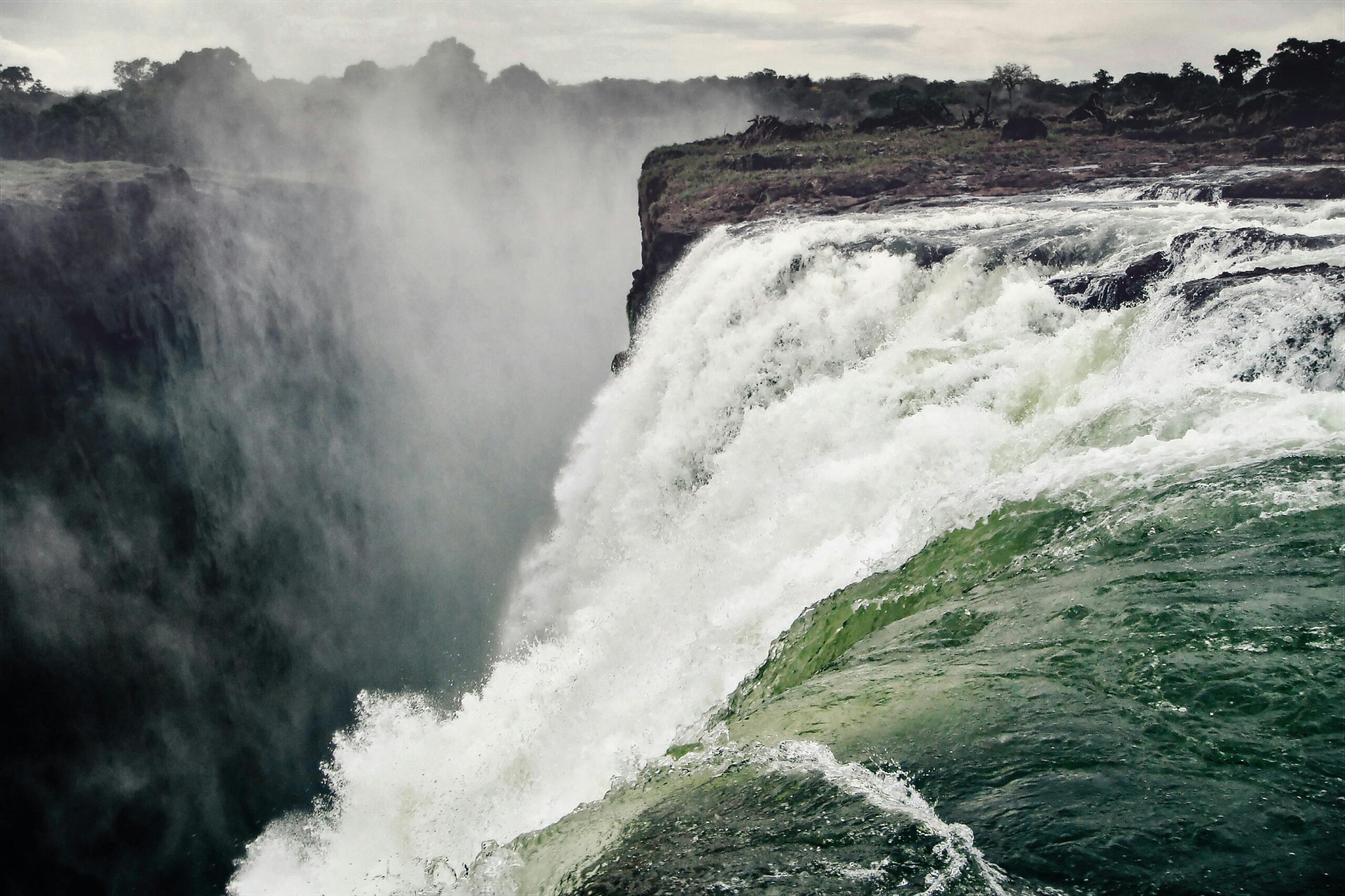 Stunning photo capturing the powerful flow and grandeur of Victoria Falls, Zimbabwe.